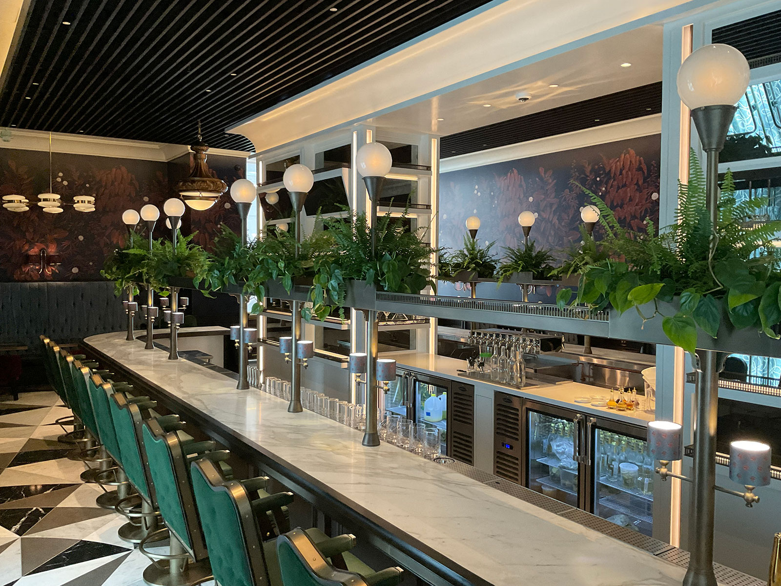 Long bar with metal posts, rail and overhead steel